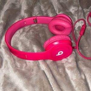 Bright pink beats headphones